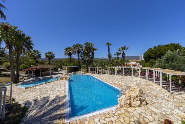 Indoor pool, 2 outdoor pools, open 9 AM to 6:00 PM, pool umbrellas