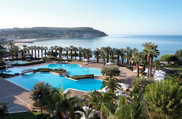 Outdoor pool, an infinity pool, pool umbrellas
