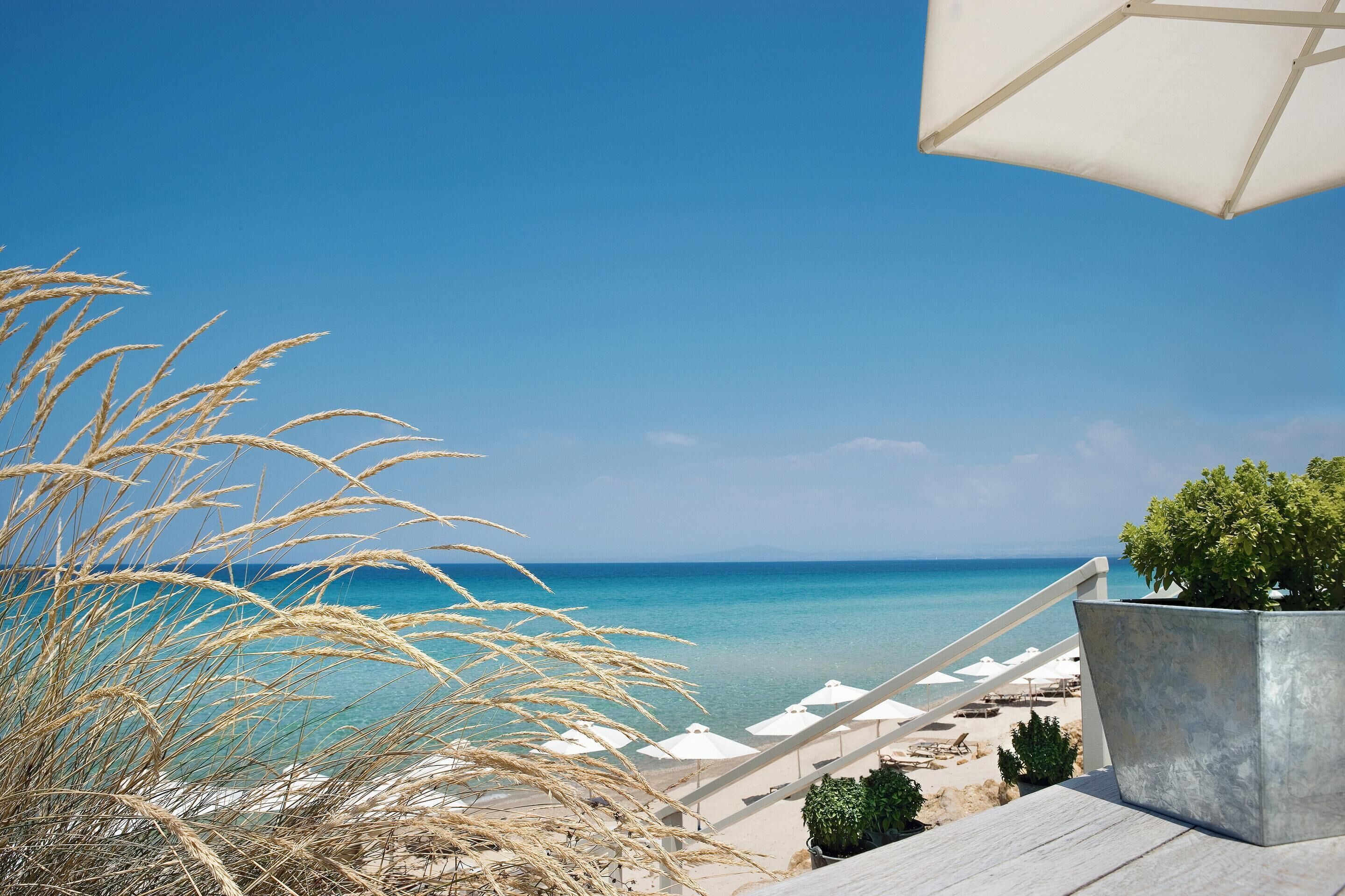 Private beach, beach umbrellas, beach towels, beach massages
