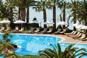 Outdoor pool, an infinity pool, pool umbrellas