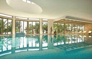 Outdoor pool, an infinity pool, pool umbrellas