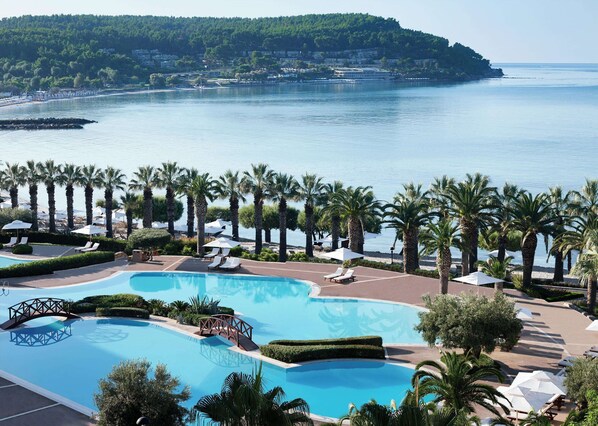Outdoor pool, an infinity pool, pool umbrellas
