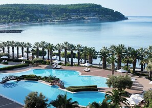 Outdoor pool, an infinity pool, pool umbrellas