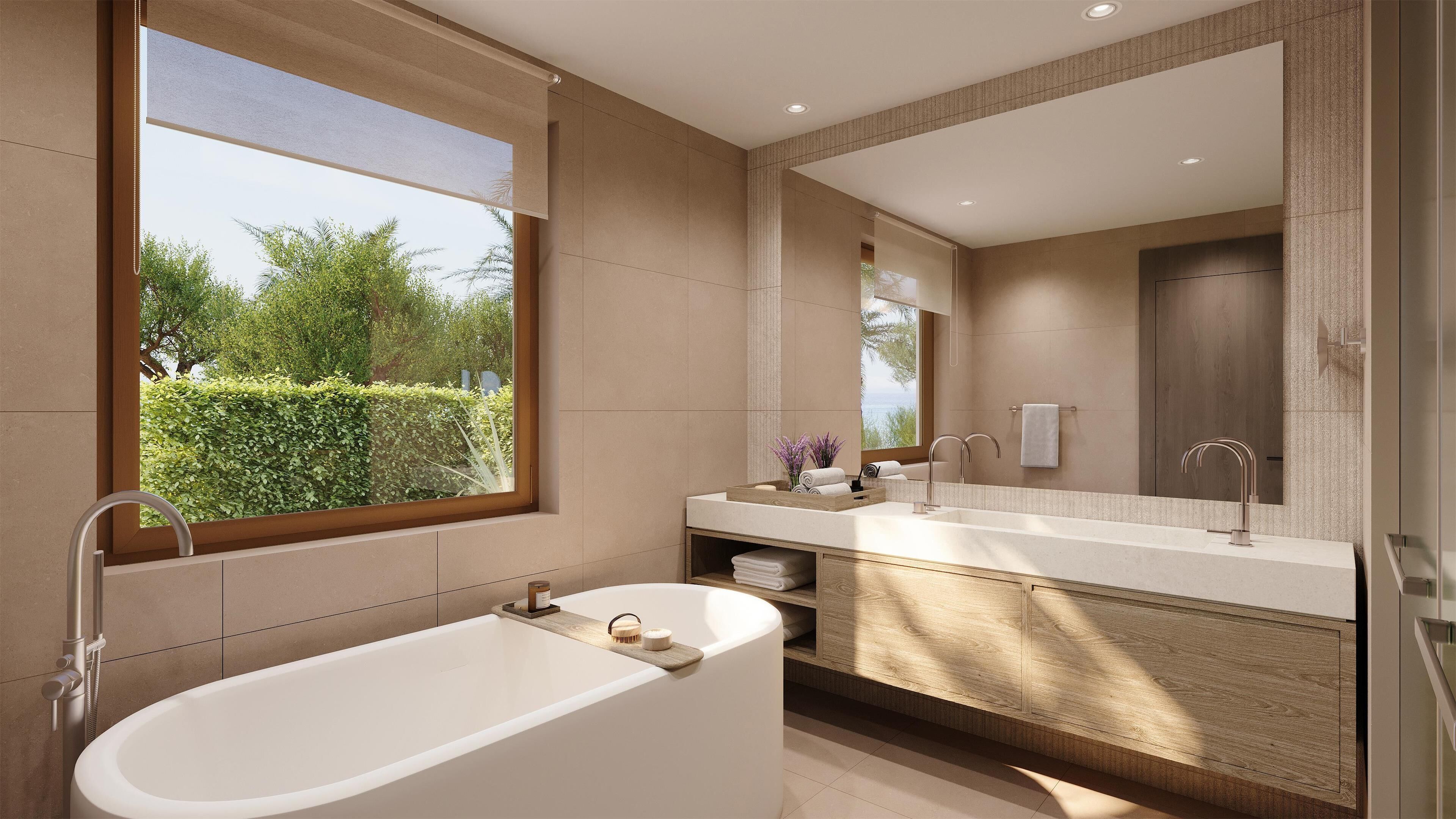 A modern bathroom with a freestanding bathtub, a large mirror, and a window providing a view of greenery.