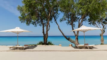 Private beach, beach umbrellas, beach towels, beach bar