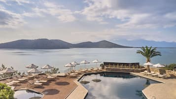 Indoor pool, 3 outdoor pools, open 10:00 AM to 6:00 PM, pool umbrellas