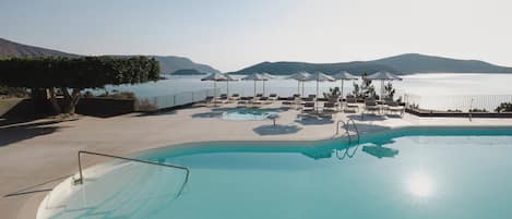 Indoor pool, 3 outdoor pools, open 10:00 AM to 6:00 PM, pool umbrellas