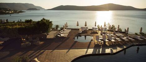 Indoor pool, 3 outdoor pools, open 10:00 AM to 6:00 PM, pool umbrellas