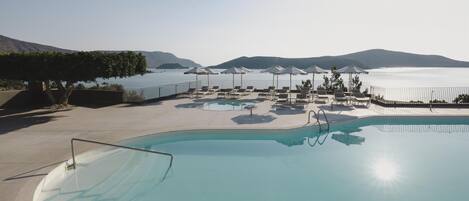 Indoor pool, 3 outdoor pools, open 10:00 AM to 6:00 PM, pool umbrellas