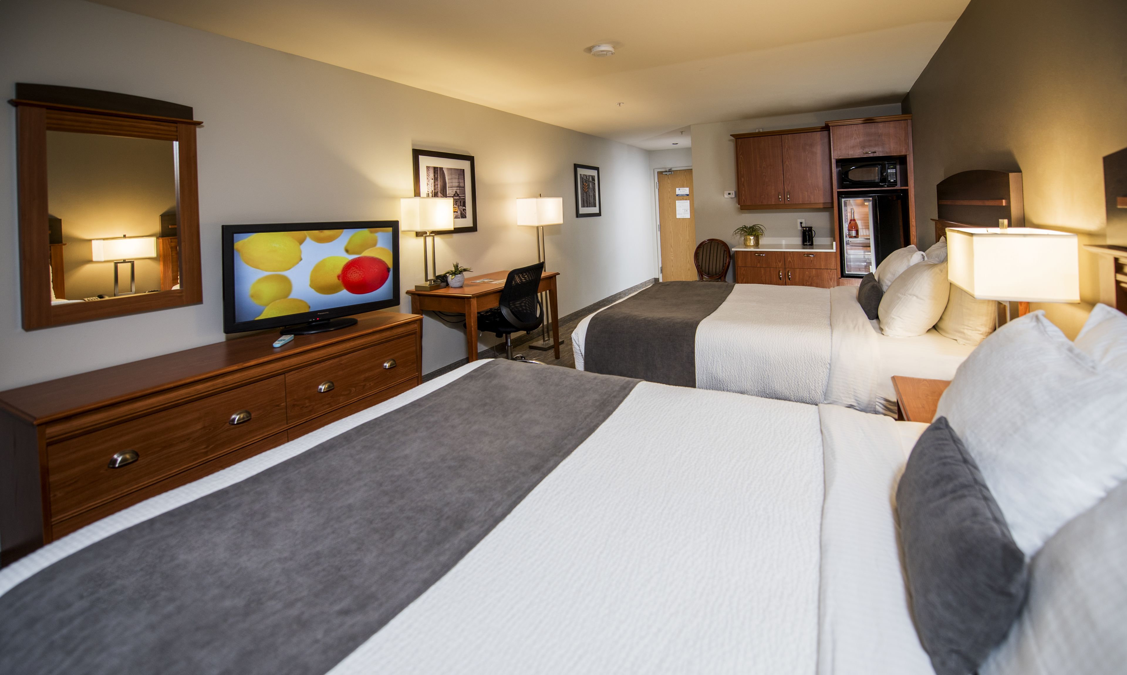 suite, 2 queen beds, non smoking, refrigerator & microwave | in-room safe, desk, iron/ironing board, free wifi