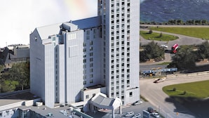 A high-rise hotel with a modern architectural design, featuring a prominent entrance and multiple floors.