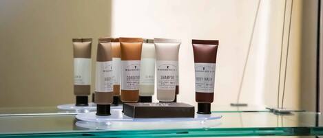 A display of Woodbury & Co. skincare products on a glass shelf.