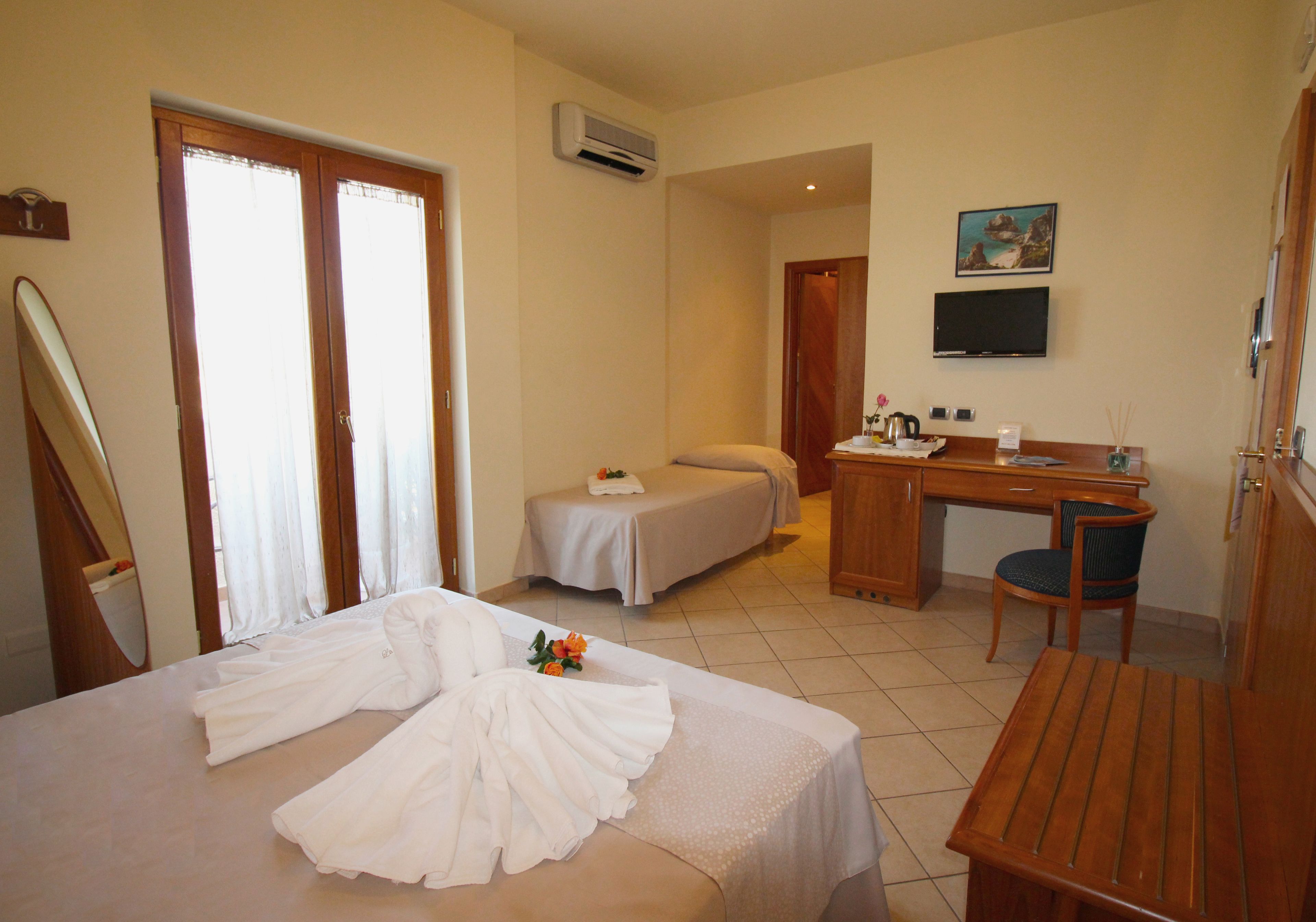 superior triple room, partial ocean view | egyptian cotton sheets, premium bedding, select comfort beds