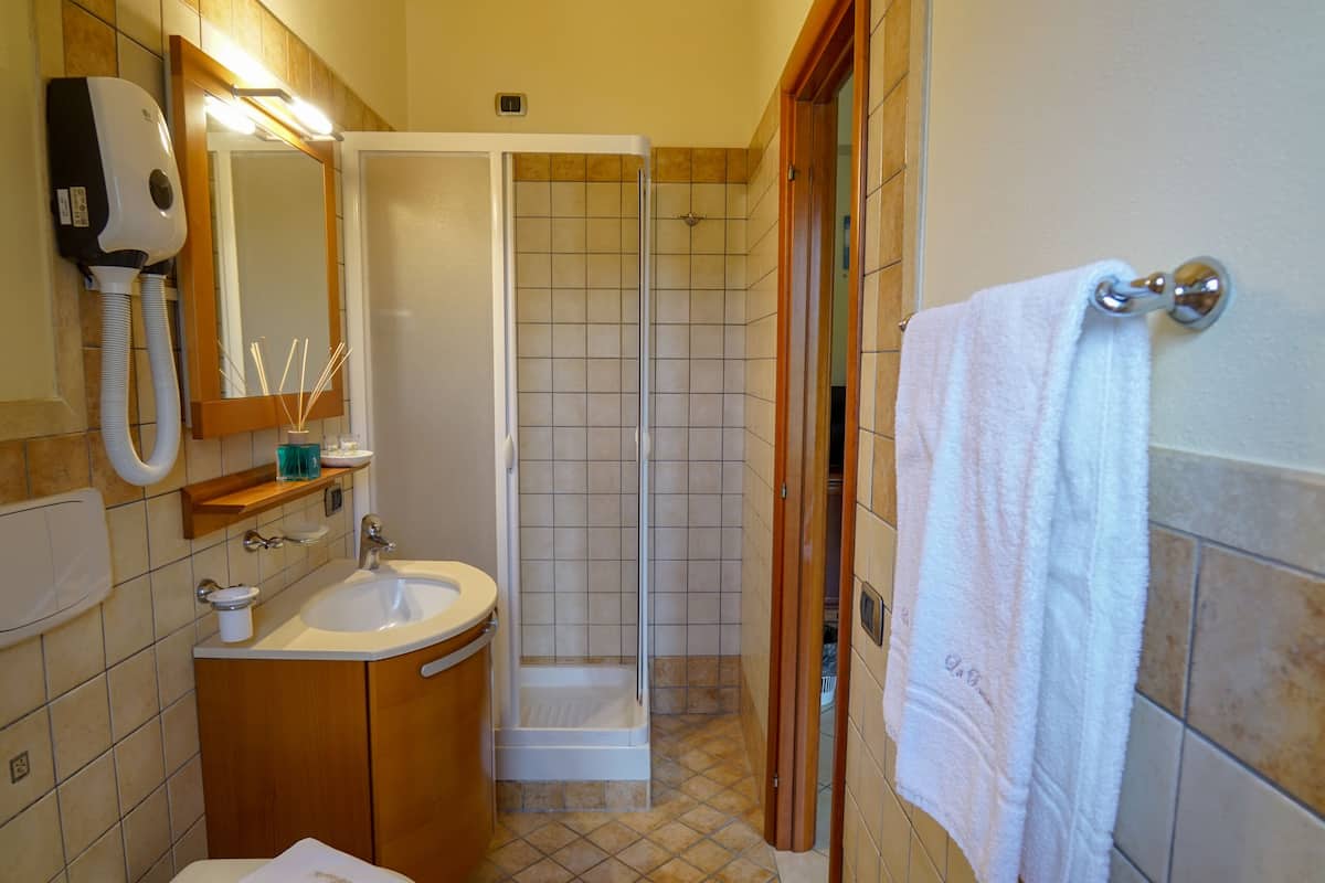 shower, rainfall showerhead, designer toiletries, hair dryer