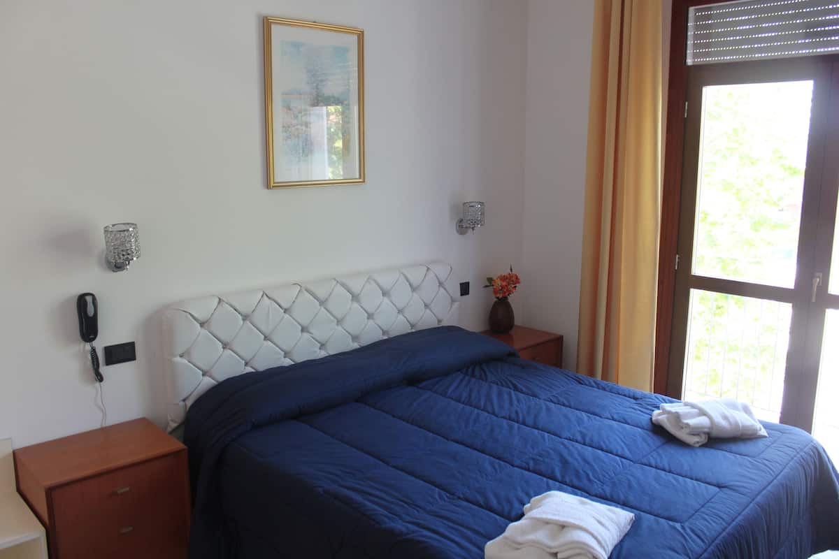 Quadruple Room | Down comforters, minibar, in-room safe, desk