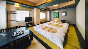 Premium bedding, desk, laptop workspace, iron/ironing board