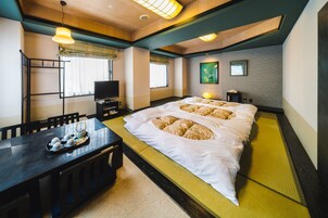 Premium bedding, desk, laptop workspace, iron/ironing board