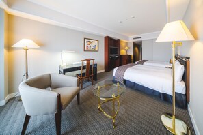 Premium bedding, desk, laptop workspace, iron/ironing board