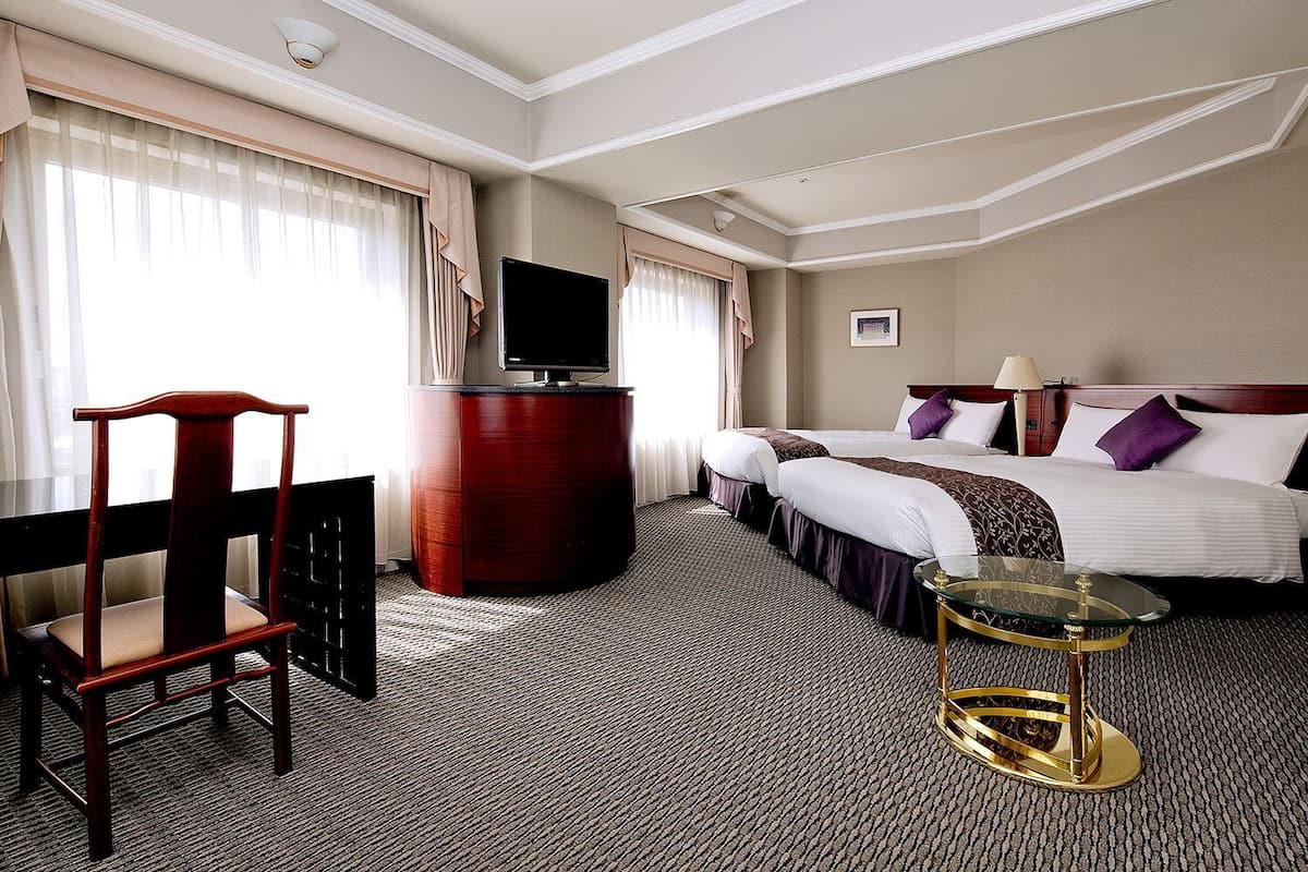 Premium bedding, desk, laptop workspace, iron/ironing board