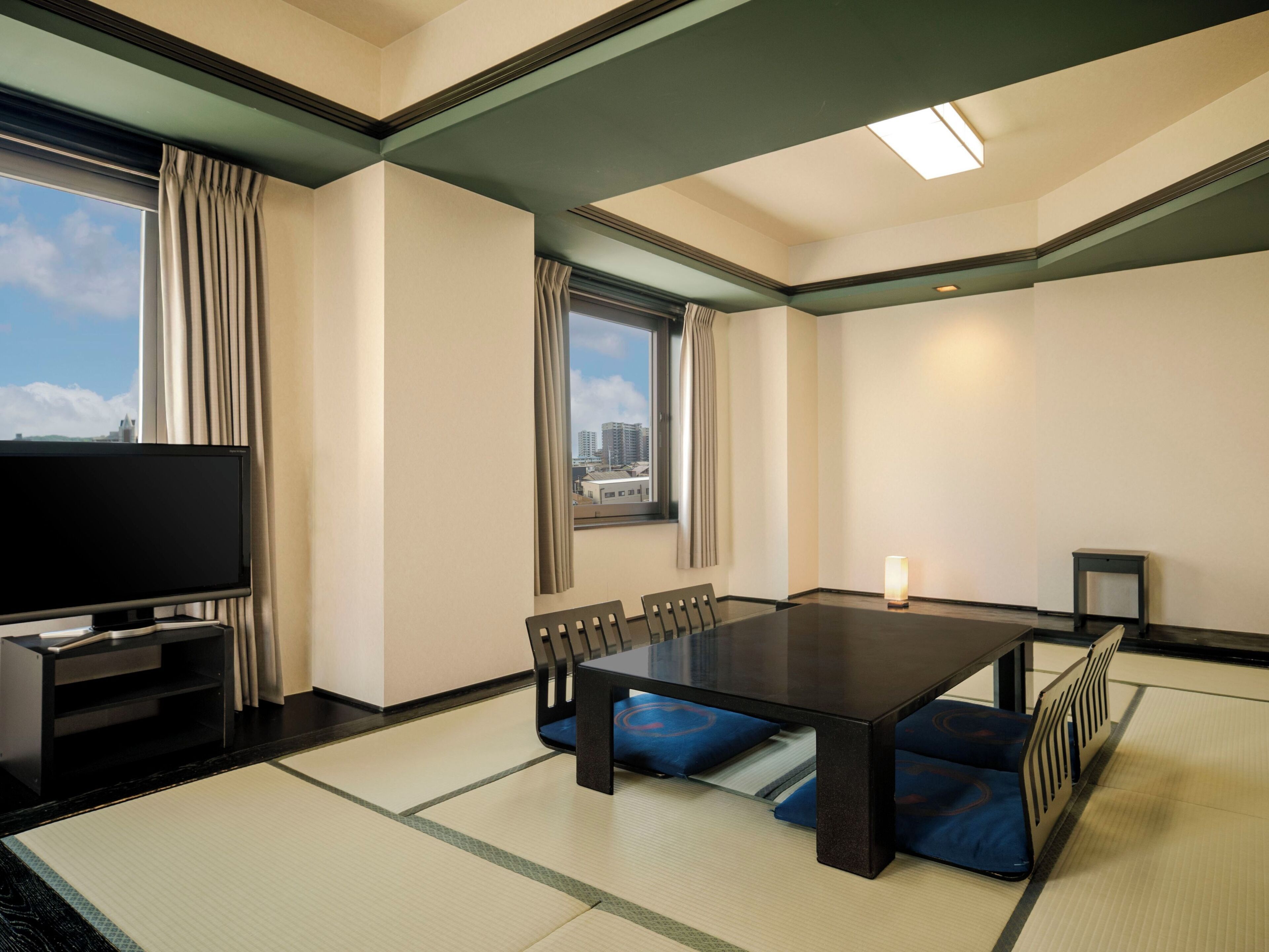Premium bedding, desk, laptop workspace, iron/ironing board