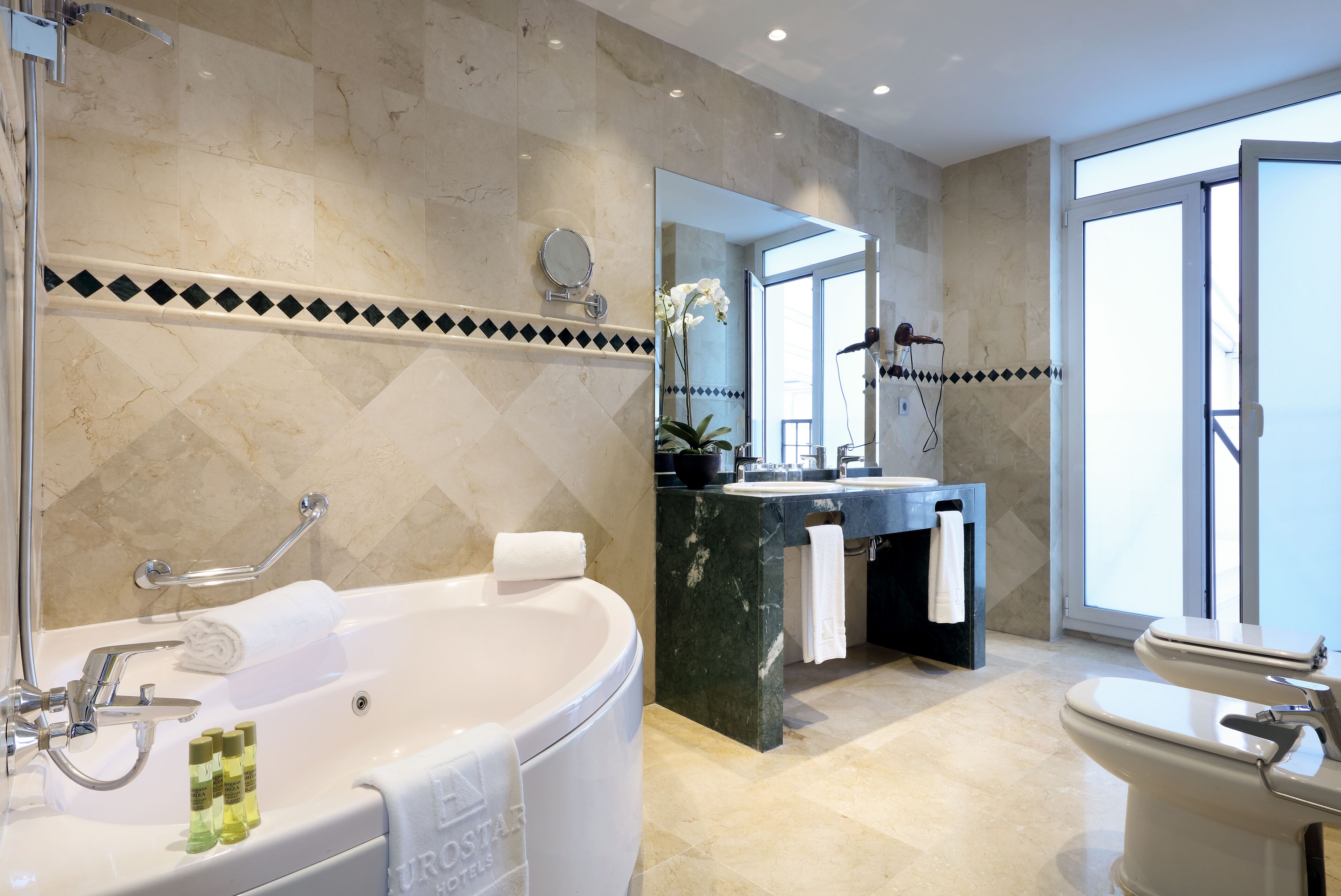 eco-friendly toiletries, hair dryer, bidet, towels