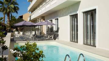 Outdoor pool, pool umbrellas, pool loungers