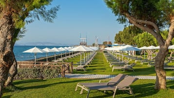 On the beach, sun loungers, beach umbrellas, beach towels