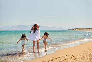 On the beach, sun loungers, beach umbrellas, beach towels