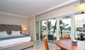 Junior Suite, Ocean View, Beachfront | In-room safe, desk, blackout curtains, iron/ironing board