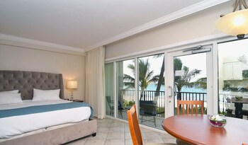 Junior Suite, Ocean View, Beachfront | In-room safe, desk, blackout drapes, iron/ironing board at The Sea Lord Hotel & Suites (Adults Only)
