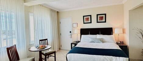 Economy Room, 1 Queen Bed | In-room safe, desk, blackout curtains, iron/ironing board