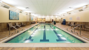 An indoor swimming pool with clear lanes, safety railings, and a tiled floor. - Hilton Scranton & Conference Center (Scranton)