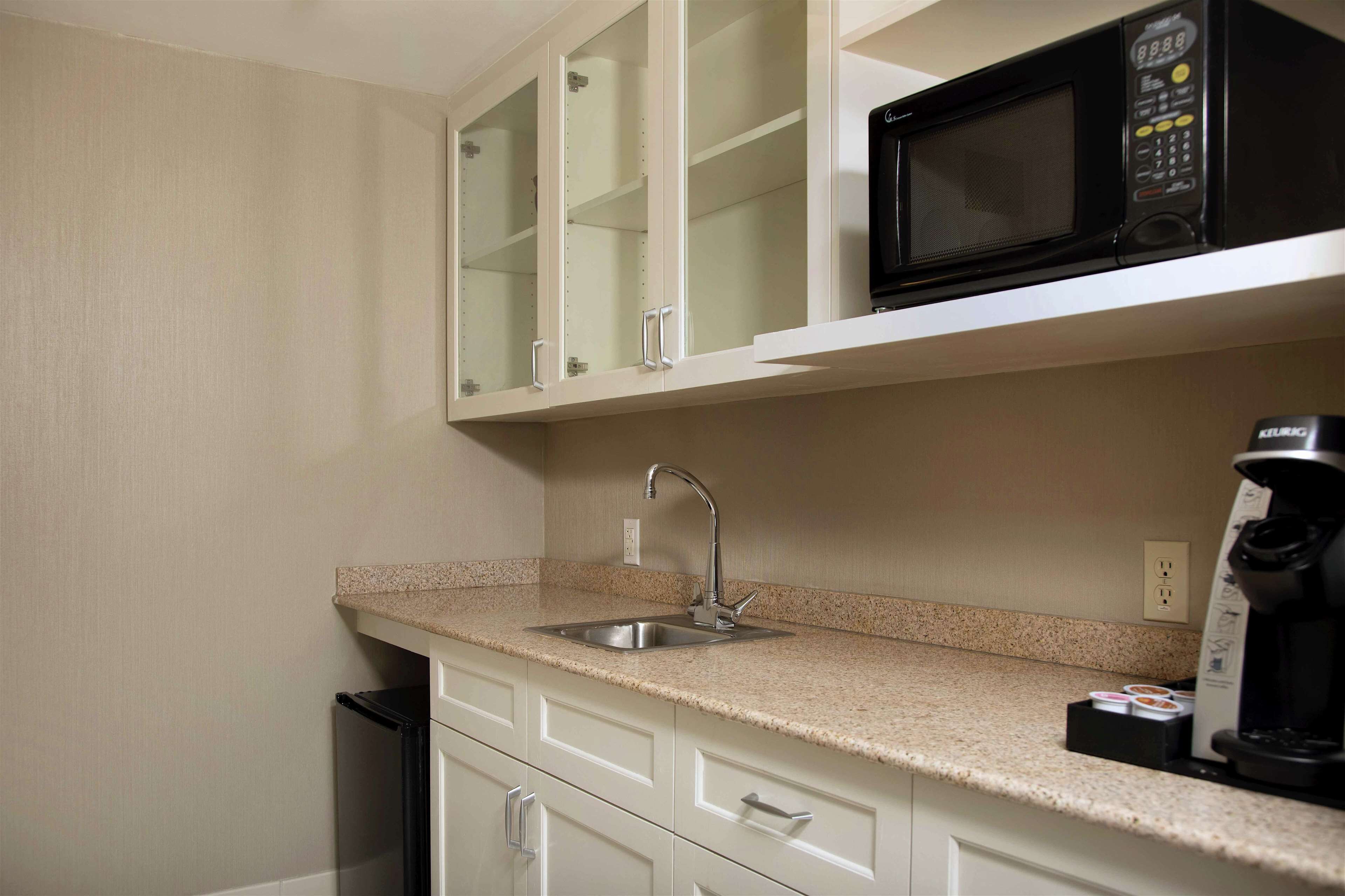 junior suite, 1 queen bed, non smoking | private kitchen | fridge, microwave, coffee/tea maker