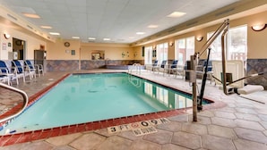 A swimming pool with a '3FT NO DIVING' sign, lounge chairs, and a tiled floor. - Comfort Inn & Suites Waco Woodway (Waco)