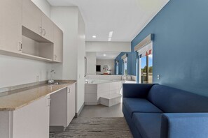Suite, 1 King Bed (Additional Living Area) | 1 bedroom, in-room safe, desk, iron/ironing board