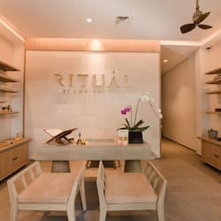 Relax in the serene reception area, where guests can unwind with a seat on the bench or chairs.