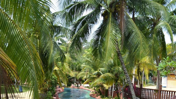 A water slide with people on inflatable tubes. - A'Famosa Resort (Alor Gajah)