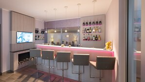A modern bar area with a TV, bar stools, and shelves of bottles. - New Orly (Munich)