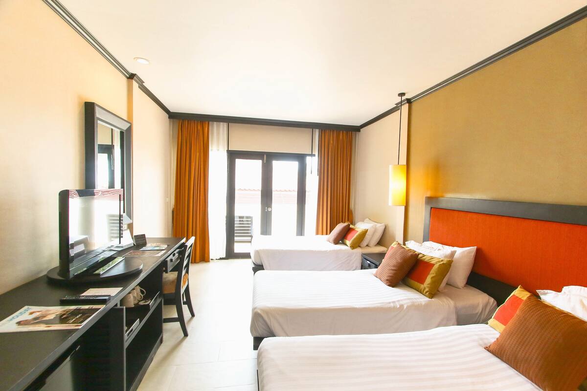 Superior Triple Room (Seaside) | Minibar, in-room safe, desk, blackout curtains