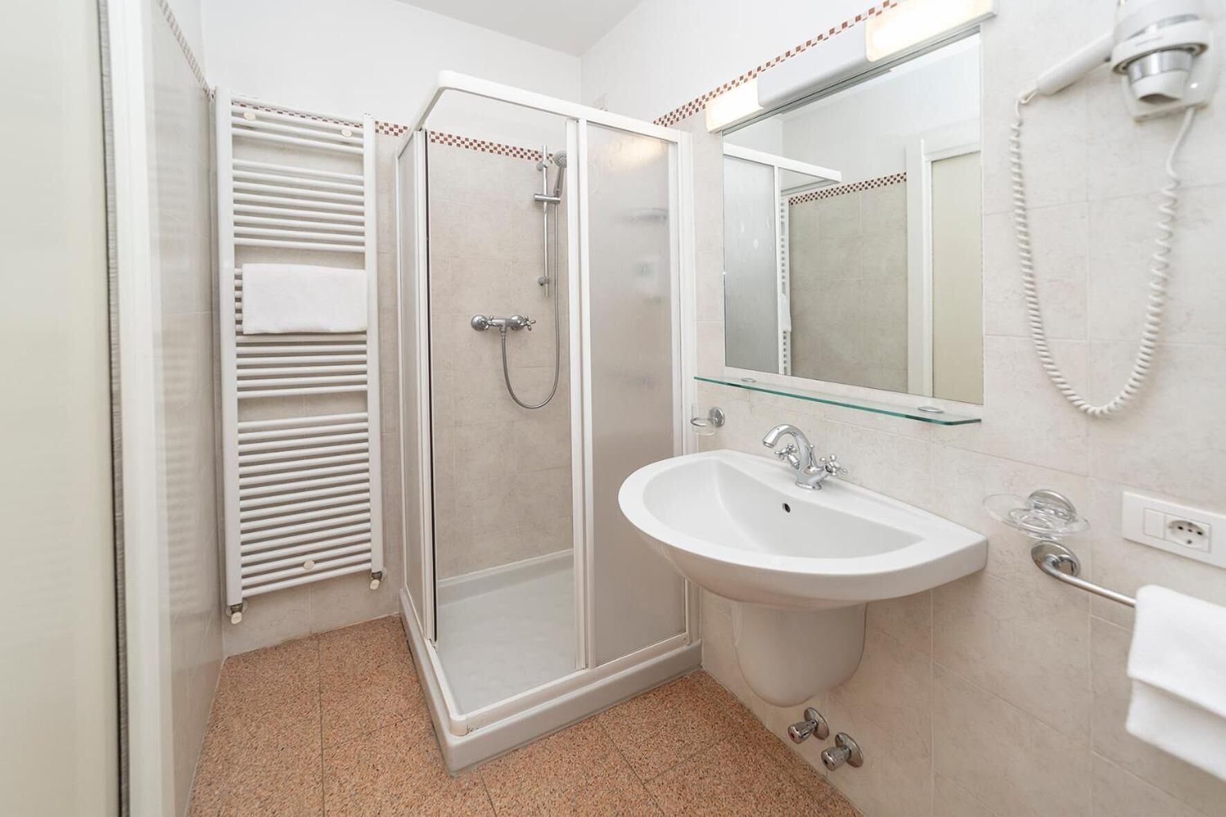 combined shower/bathtub, free toiletries, hair dryer, slippers