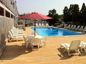 Seasonal outdoor pool, pool umbrellas, pool loungers