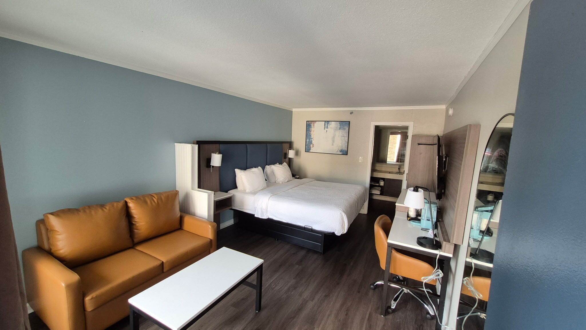 Suite, 1 King Bed, Non Smoking | Desk, laptop workspace, blackout drapes, iron/ironing board