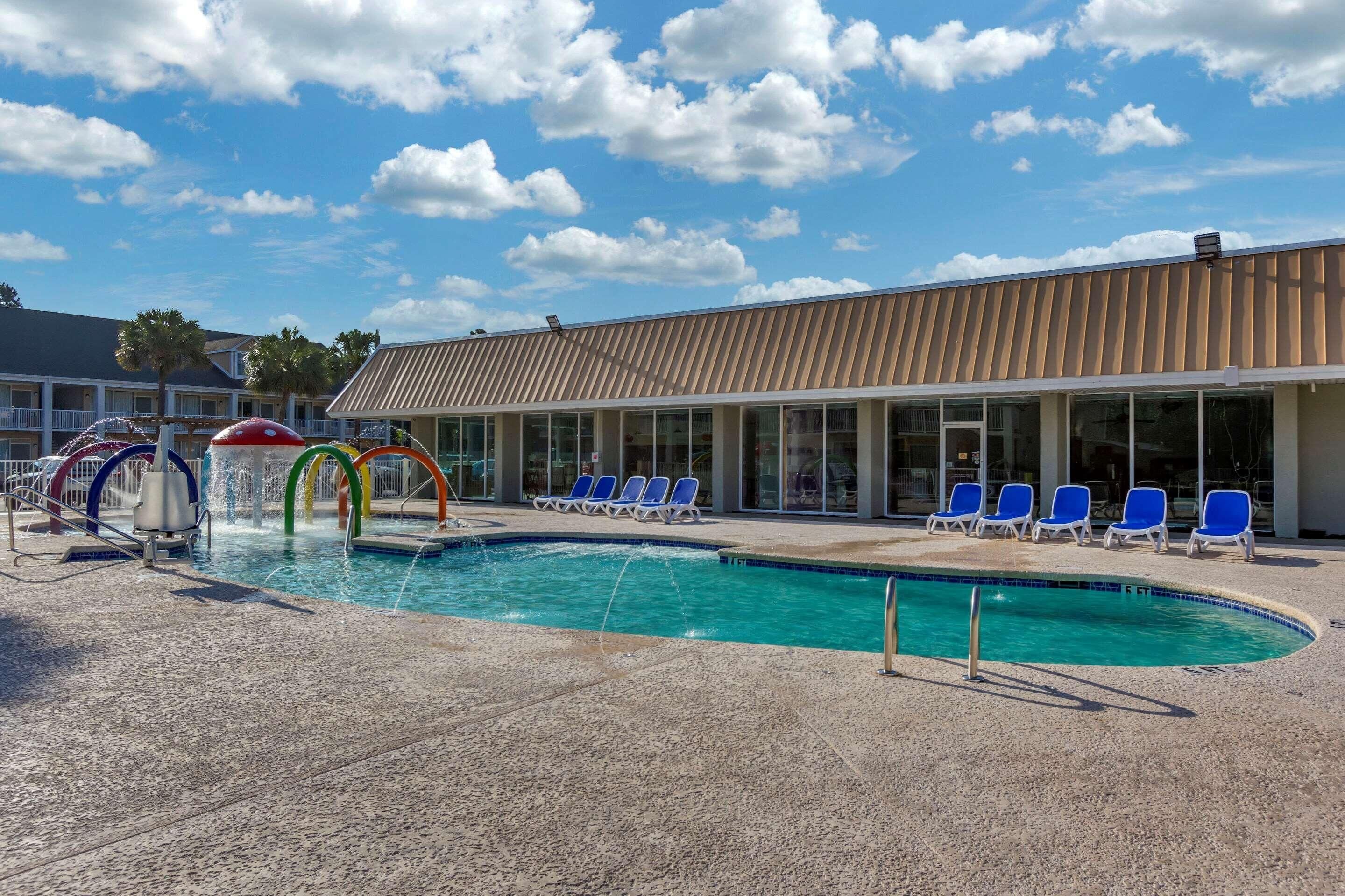 Seasonal outdoor pool, open 9:00 AM to 10:00 PM, pool umbrellas