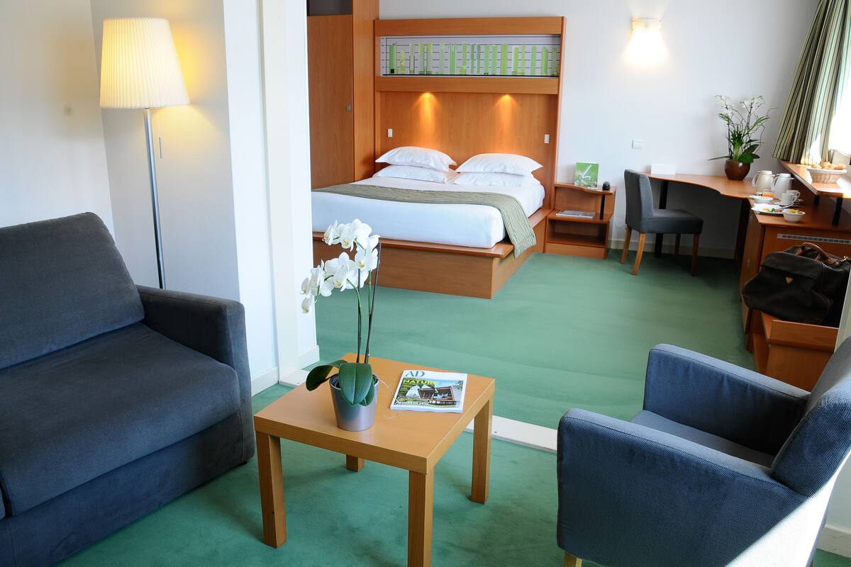 Family Room, 1 King Bed with Sofa bed, Non Smoking | In-room safe, blackout curtains, soundproofing, rollaway beds