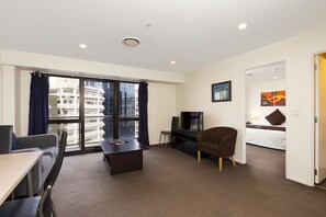 One Bedroom Apartment City View | Living area | 43-inch flat-screen TV with cable channels, TV - The Chancellor on Hobson (Auckland)