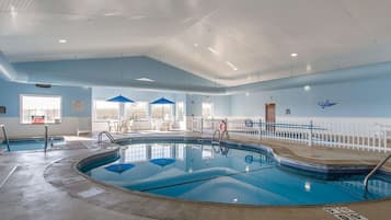 Indoor pool, open 7 AM to 10 PM, pool umbrellas