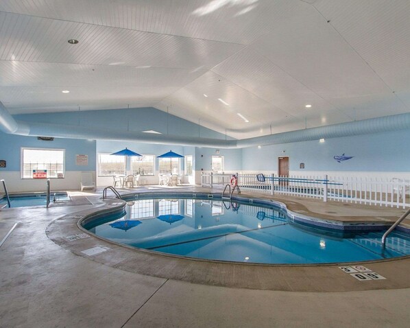 Indoor pool, open 7 AM to 10 PM, pool umbrellas