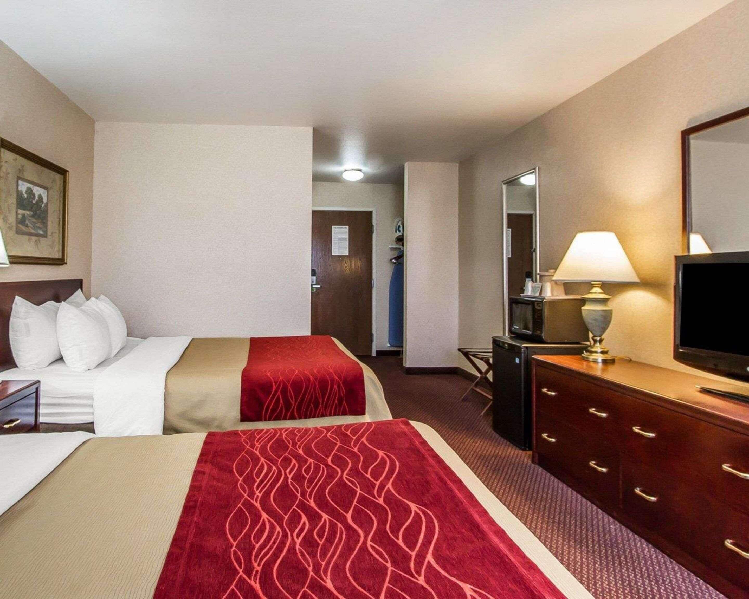 Premium bedding, desk, laptop workspace, iron/ironing board