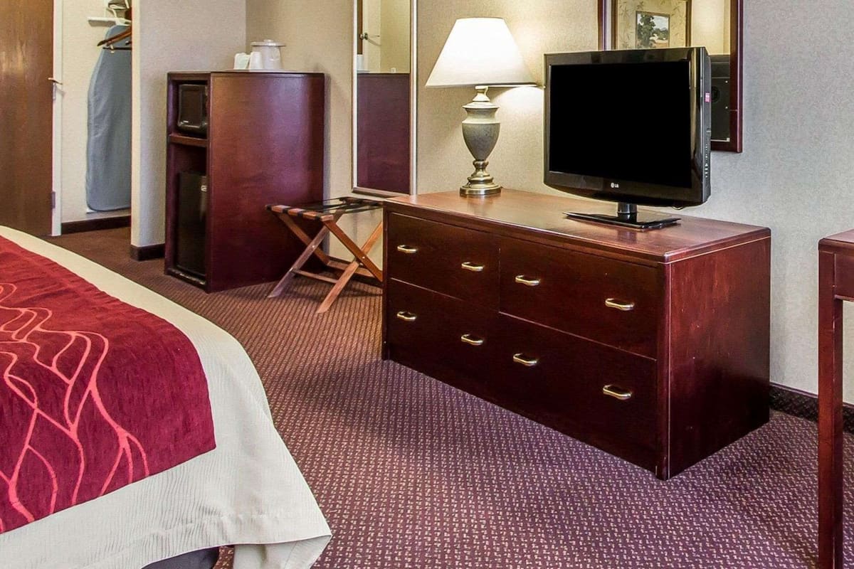 Premium bedding, desk, laptop workspace, iron/ironing board