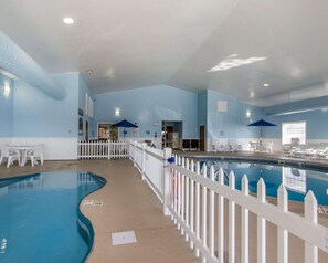 Indoor pool, open 7 AM to 10 PM, pool umbrellas